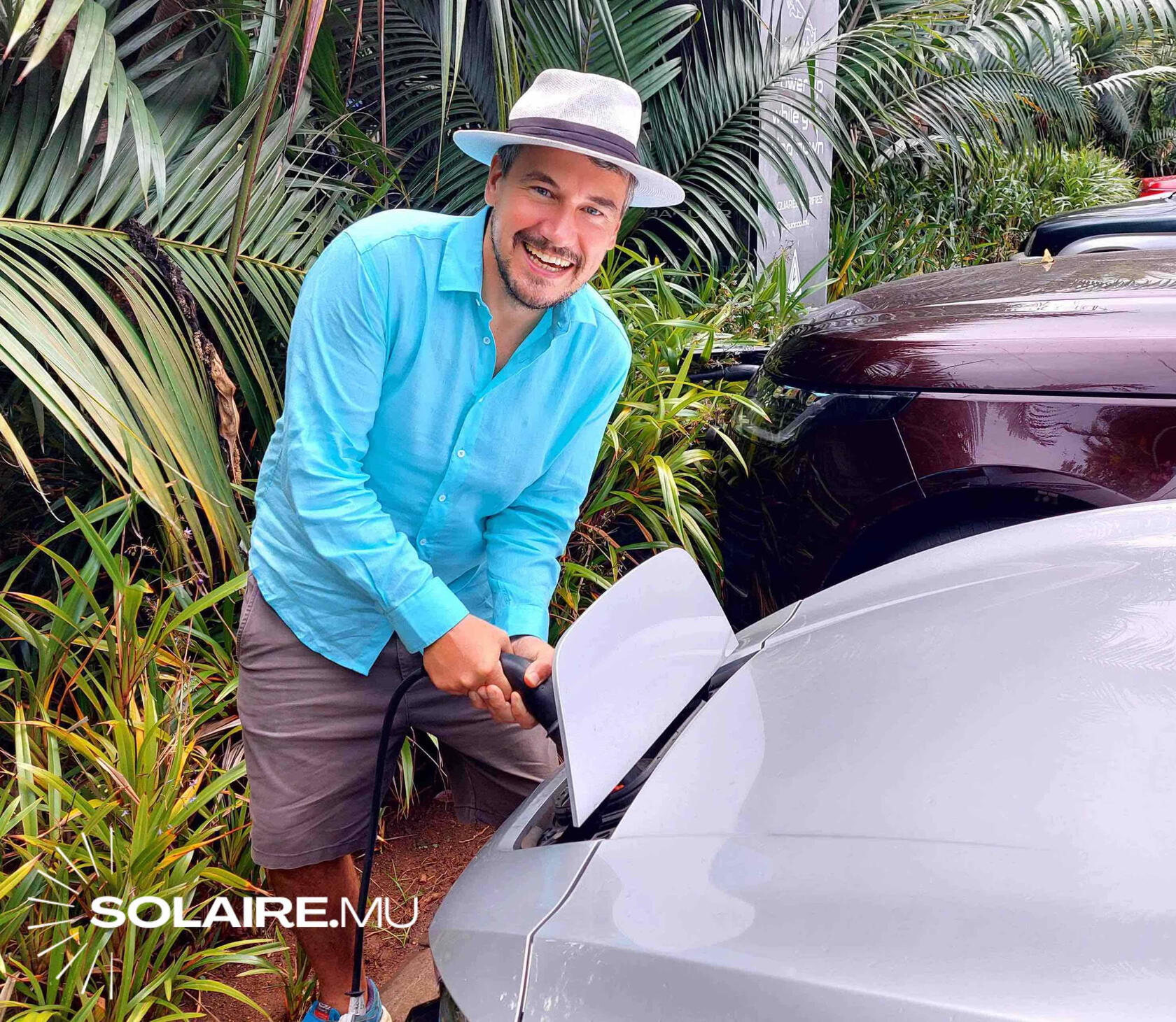 CARBONOZ founder Felix Zuckschwerdt charging an electric vehicle